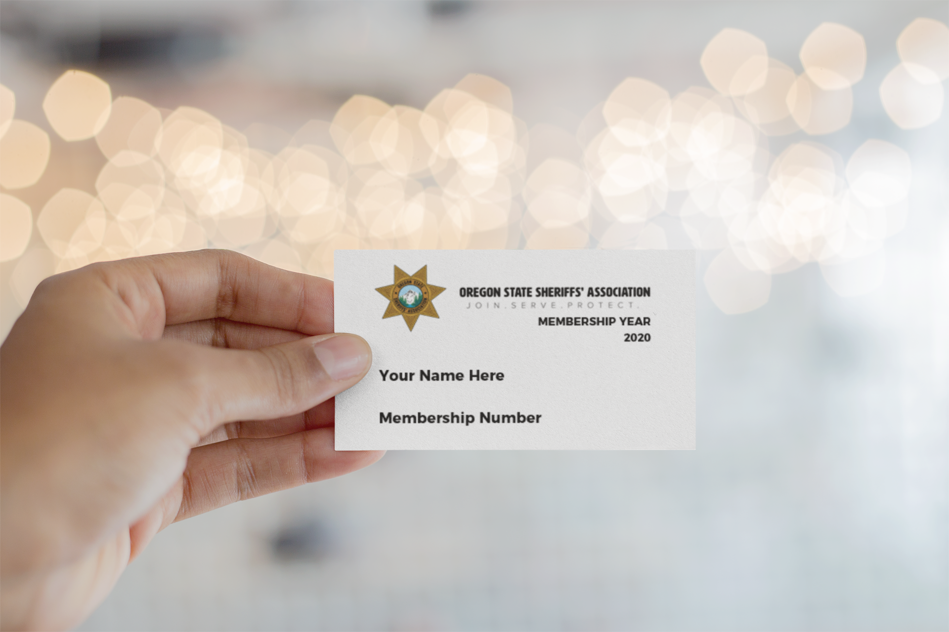 mockup-of-a-business-card-being-held-against-blurred-lights-21915-1